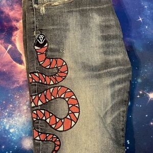 FashionNova Rocks Washed Slim Jeans with Red Snake Design